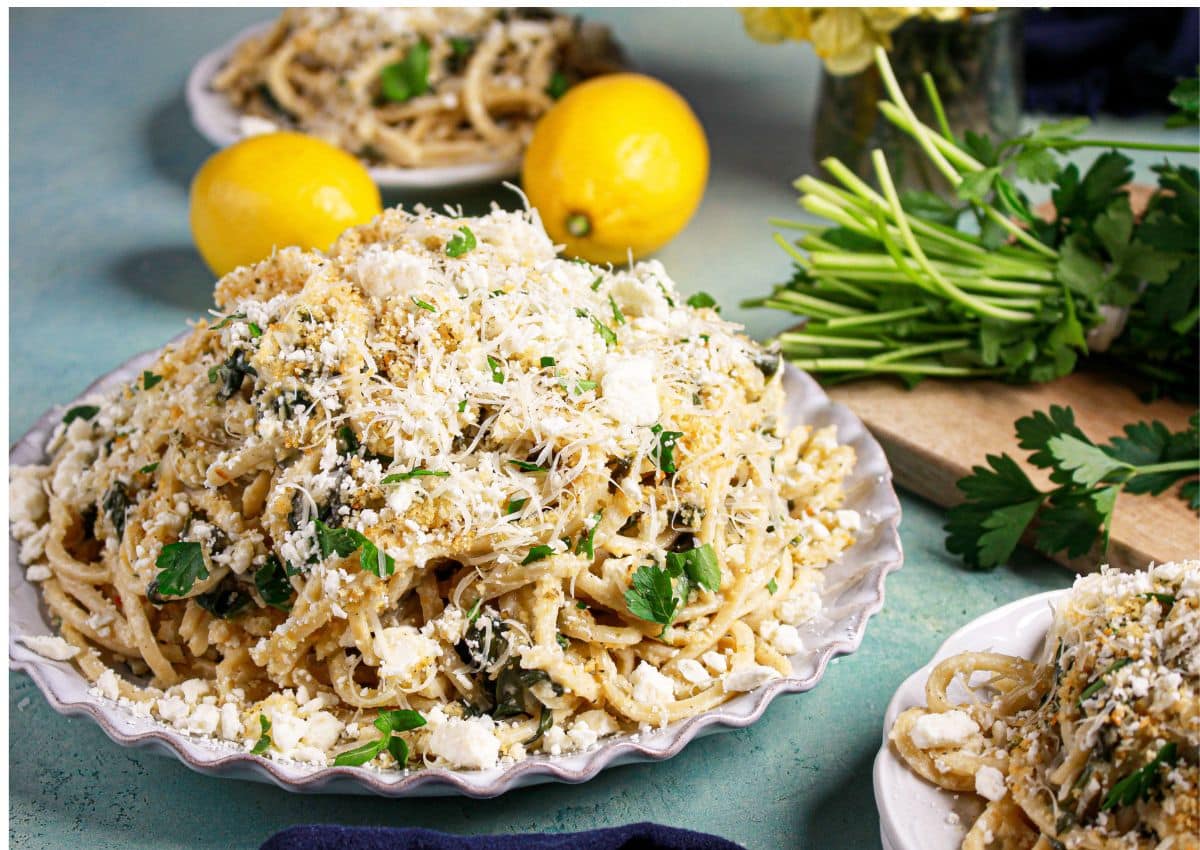 Spanakopita topped with parmesan on a plate.