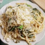 Spanakopita Pasta Spanakopita topped with parmesan on a plate.