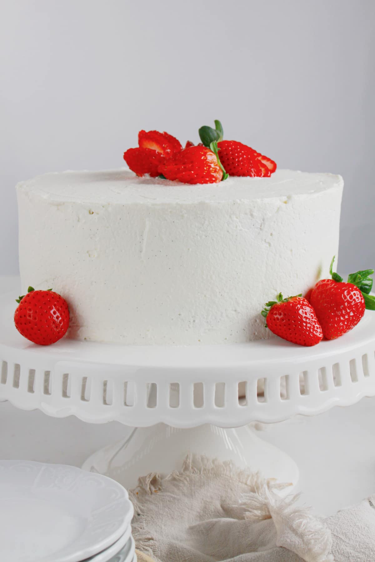 Strawberry Shortcake Cake on a cake stand.