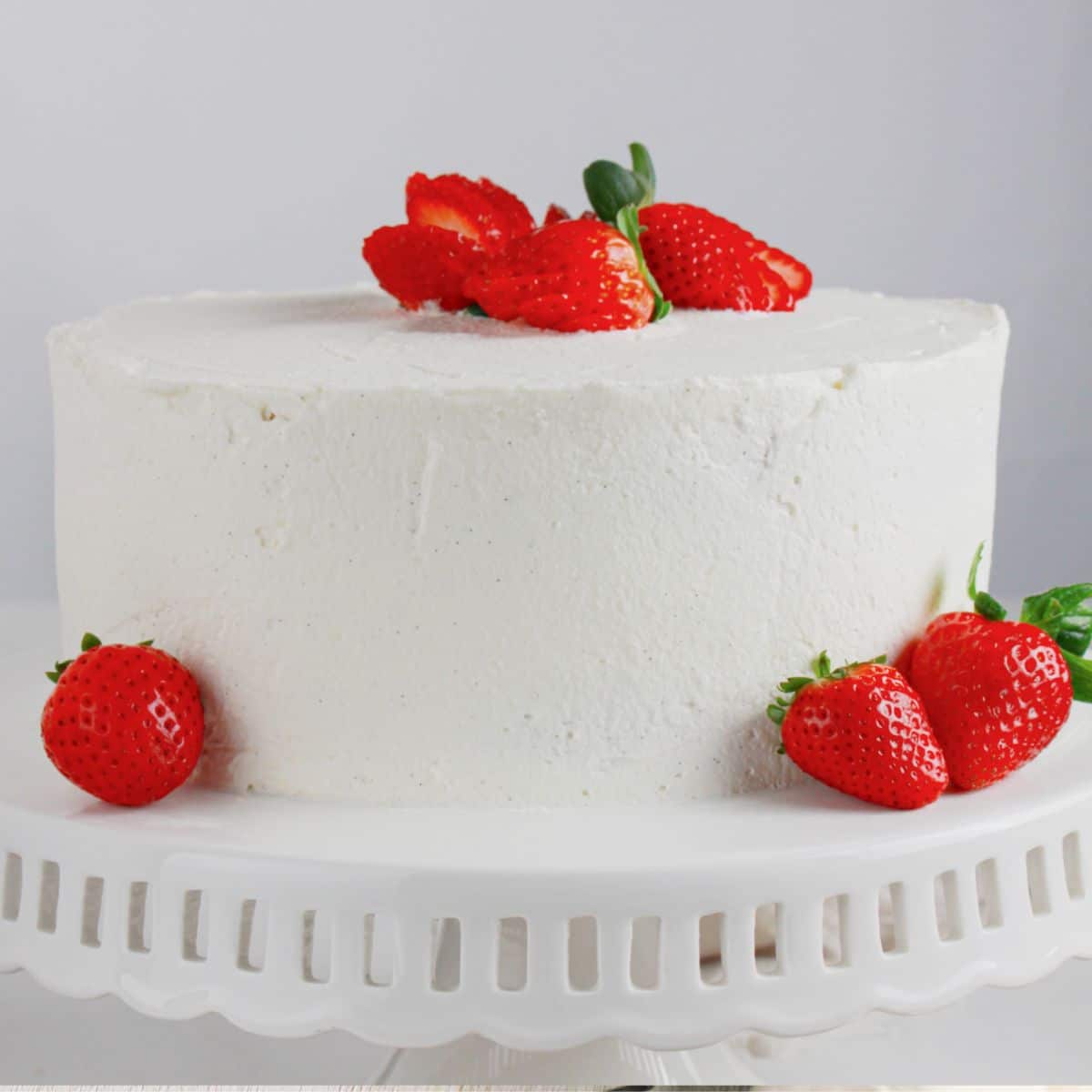 Strawberry Shortcake Cake on a cake stand.