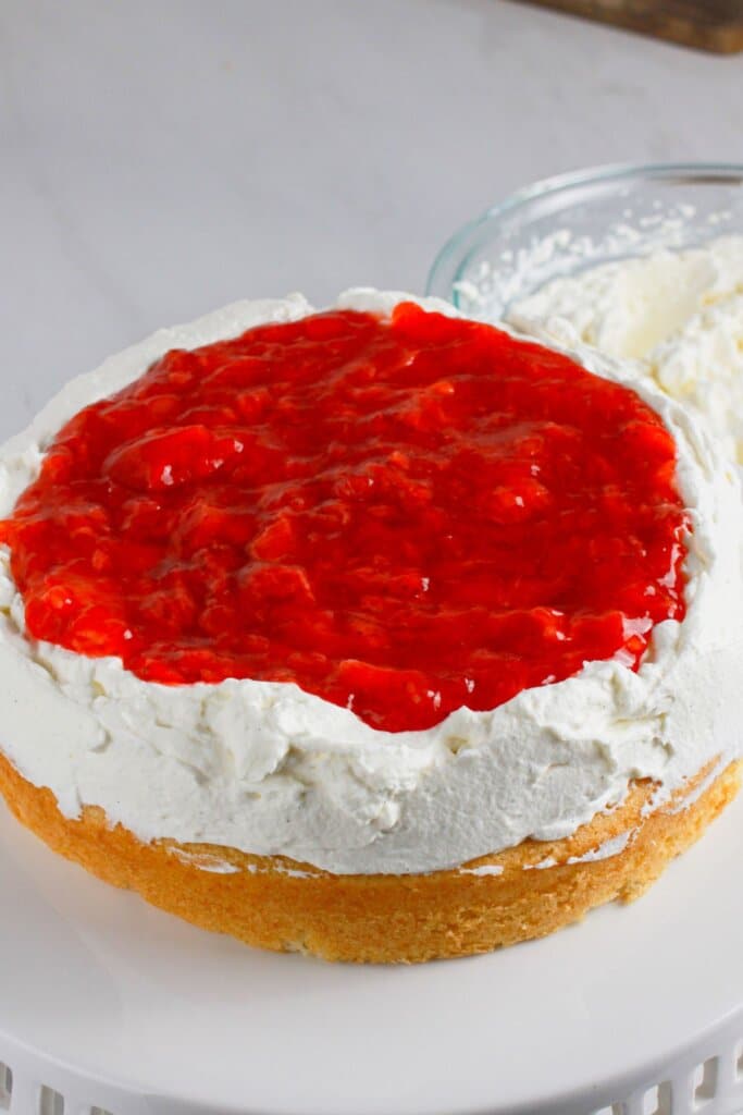 Filling being added to the top of dessert.