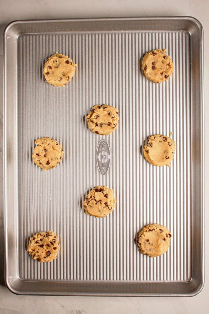 Raw cookie dough on a baking sheet.