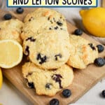 Blueberry and lemon scones on a wooden cutting board.