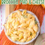 White bowl full of broccoli mac and cheese.