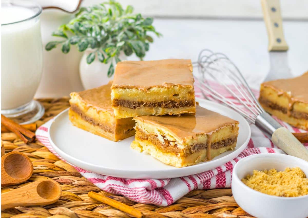 Three brown butter cinnamon bars on a small plate.