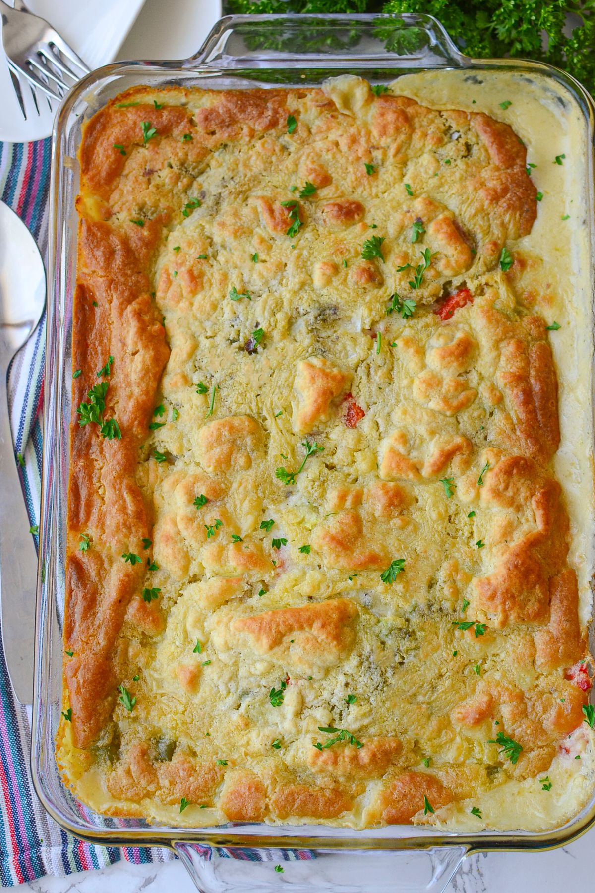 Chicken and dumpling casserole in a glass baking dish.