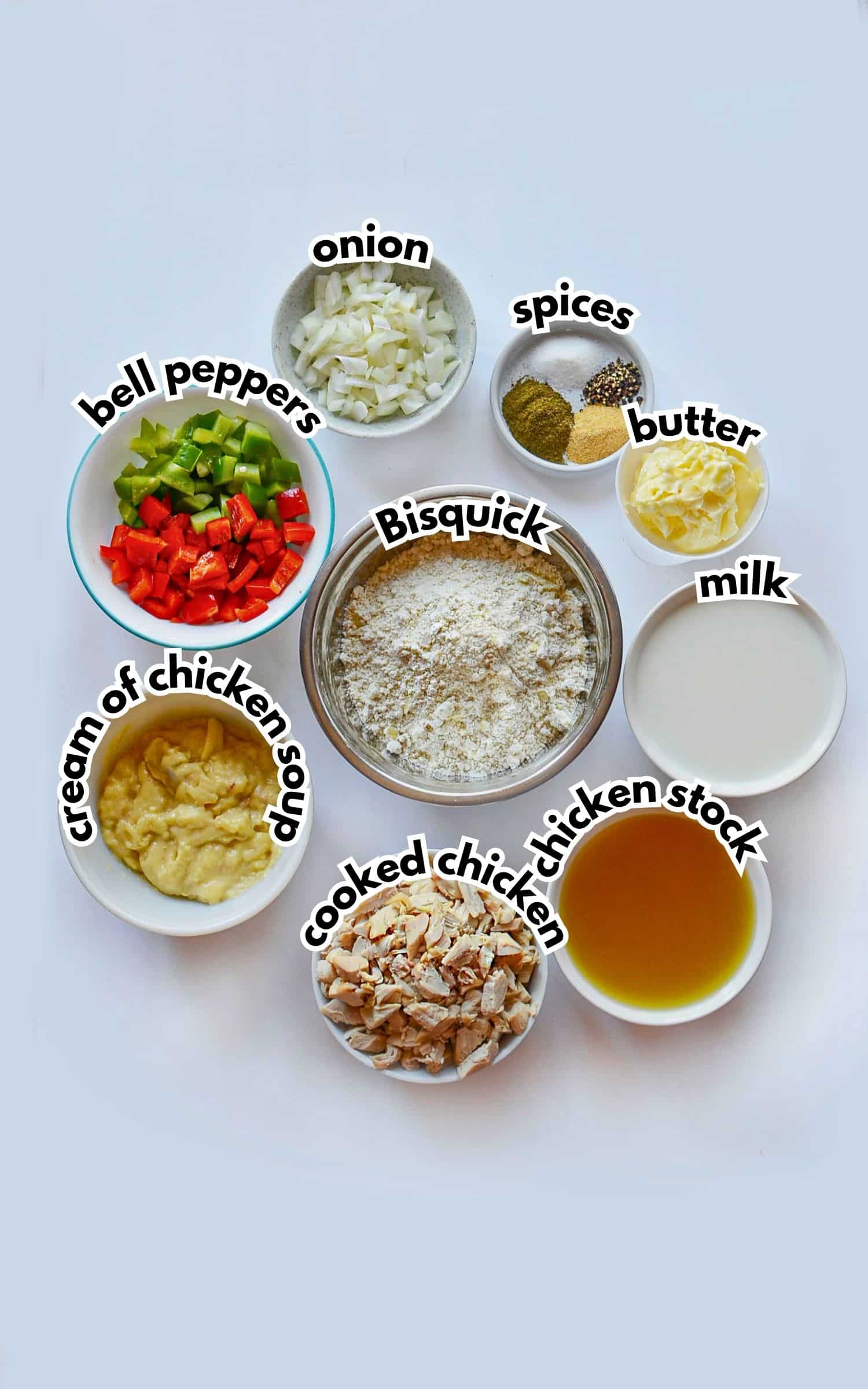 Bowls of ingredients labelled with text on a counter.