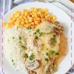 White plate with chicken gloria, white rice, and corn.