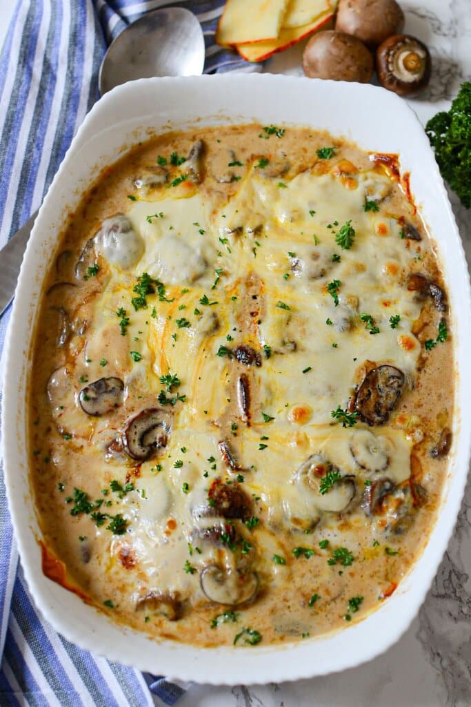 Chicken gloria in a white baking dish.