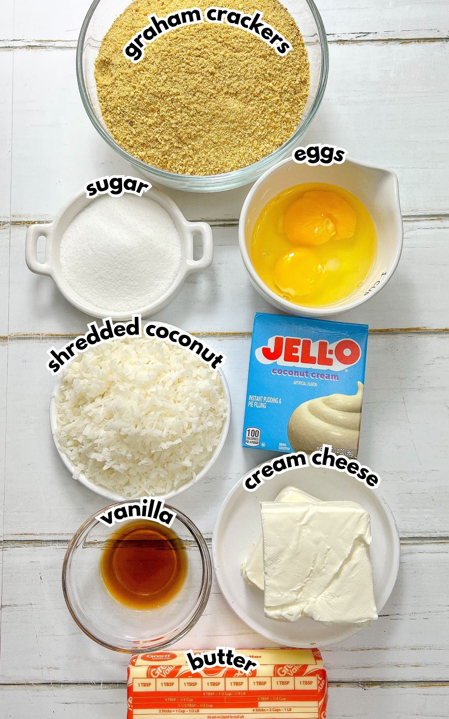 Bowls of ingredients labelled with text on a counter.