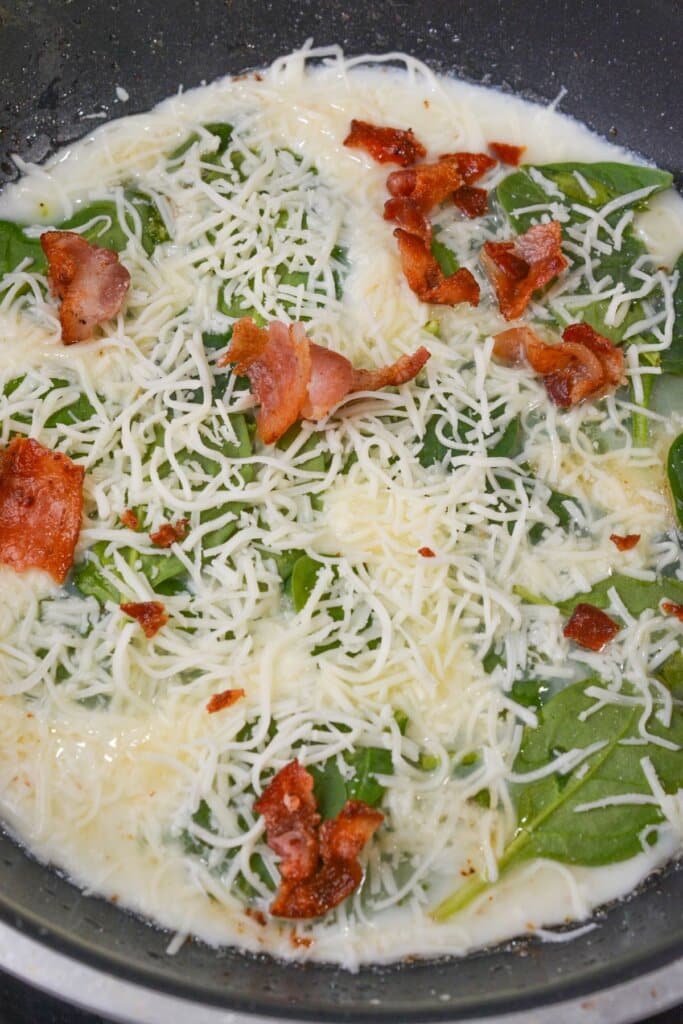 Cheese on top of spinach.