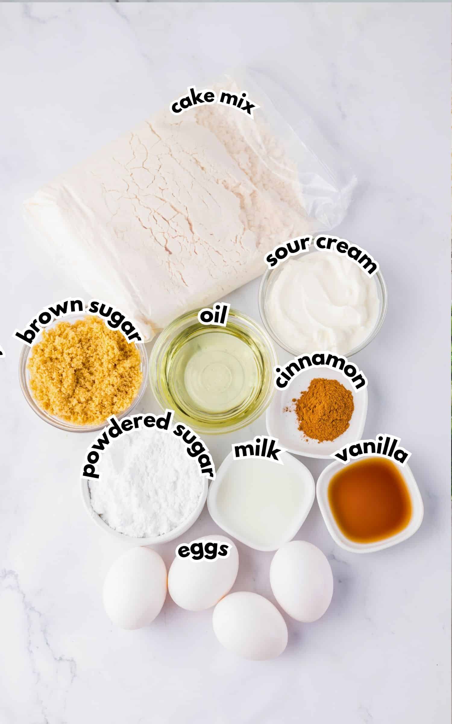 Bowls of ingredients labelled with text on a counter.