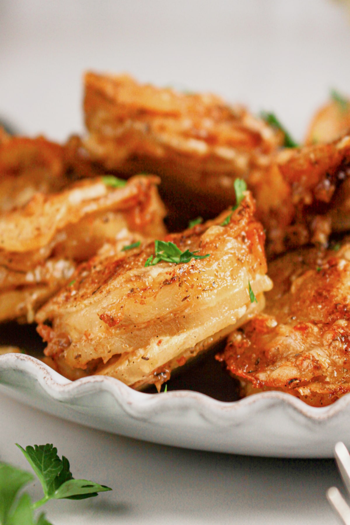 Muffin Tin Potatoes on a scalloped plate.
