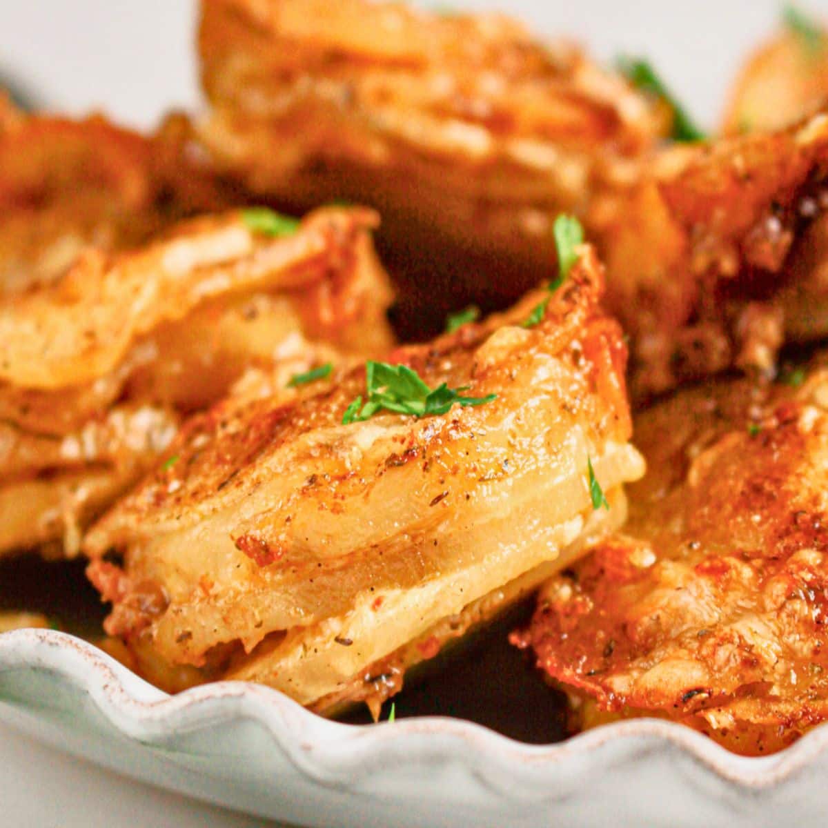 Muffin Tin Potatoes on a scalloped plate.