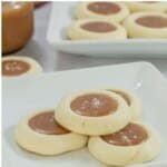 Salted caramel cookies on a white plate.