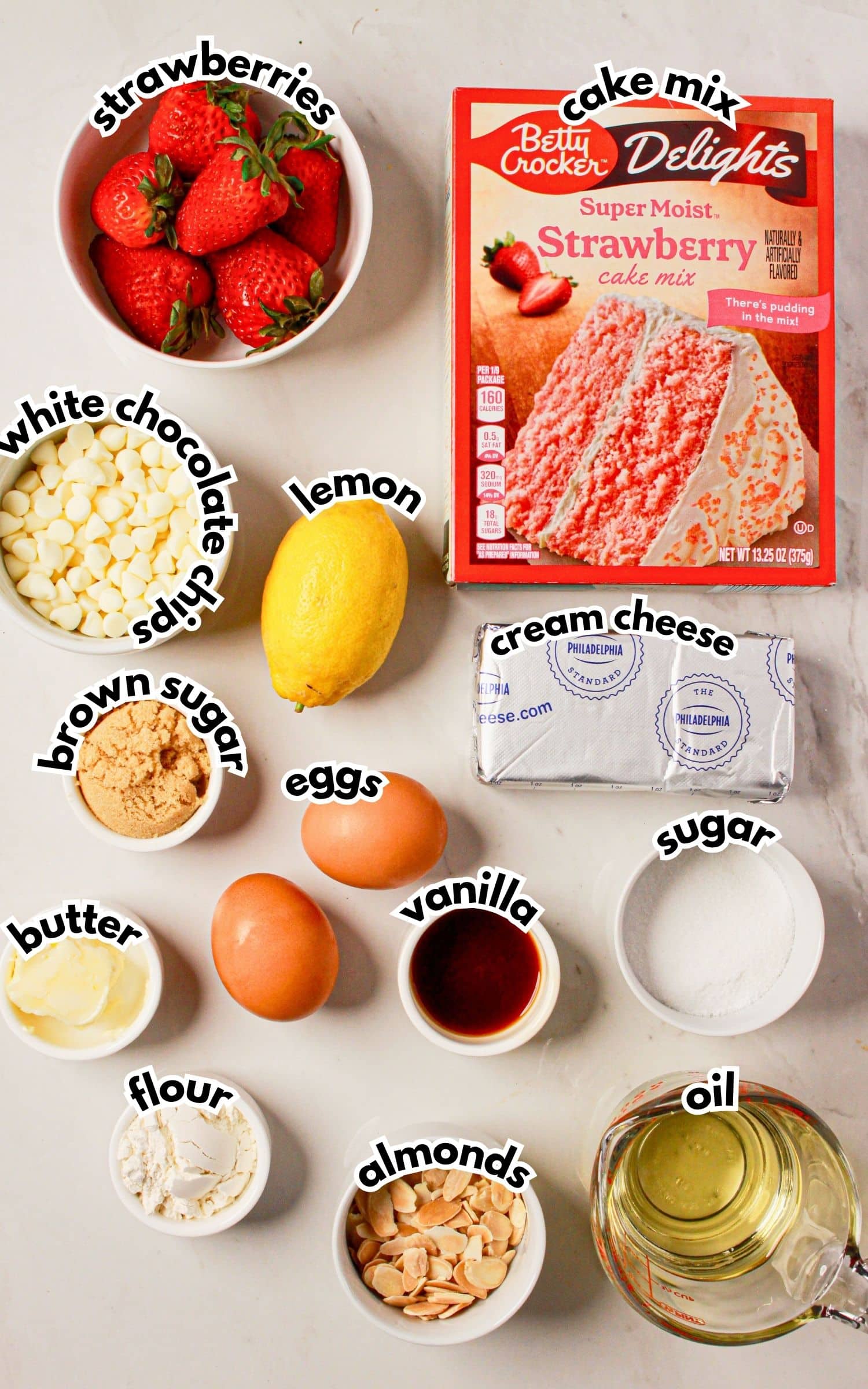 Bowls of ingredients labelled with text on a counter.