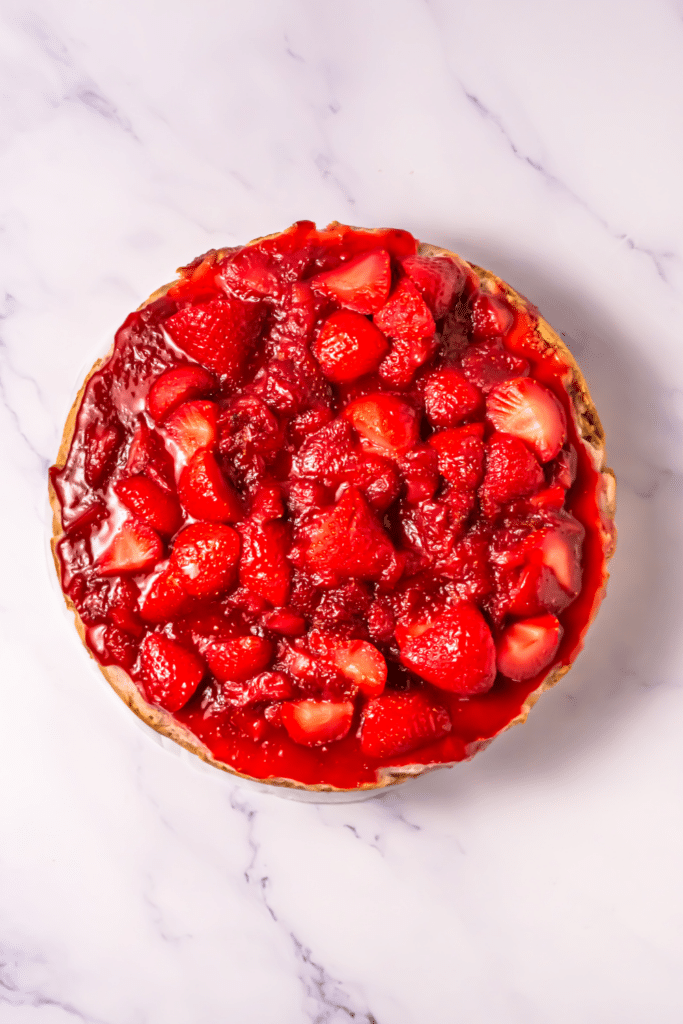 Spread topping over cheesecake
