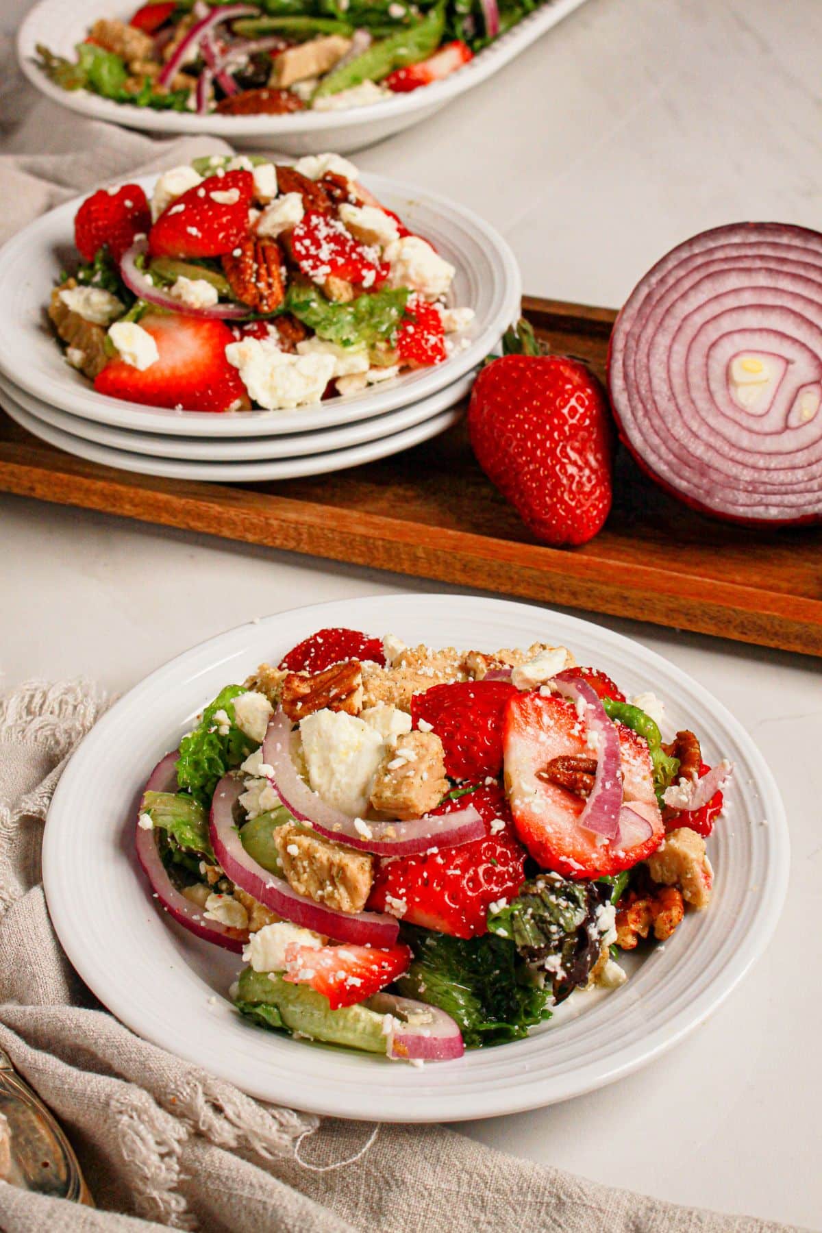 Small plate filled with strawberry fields salad.