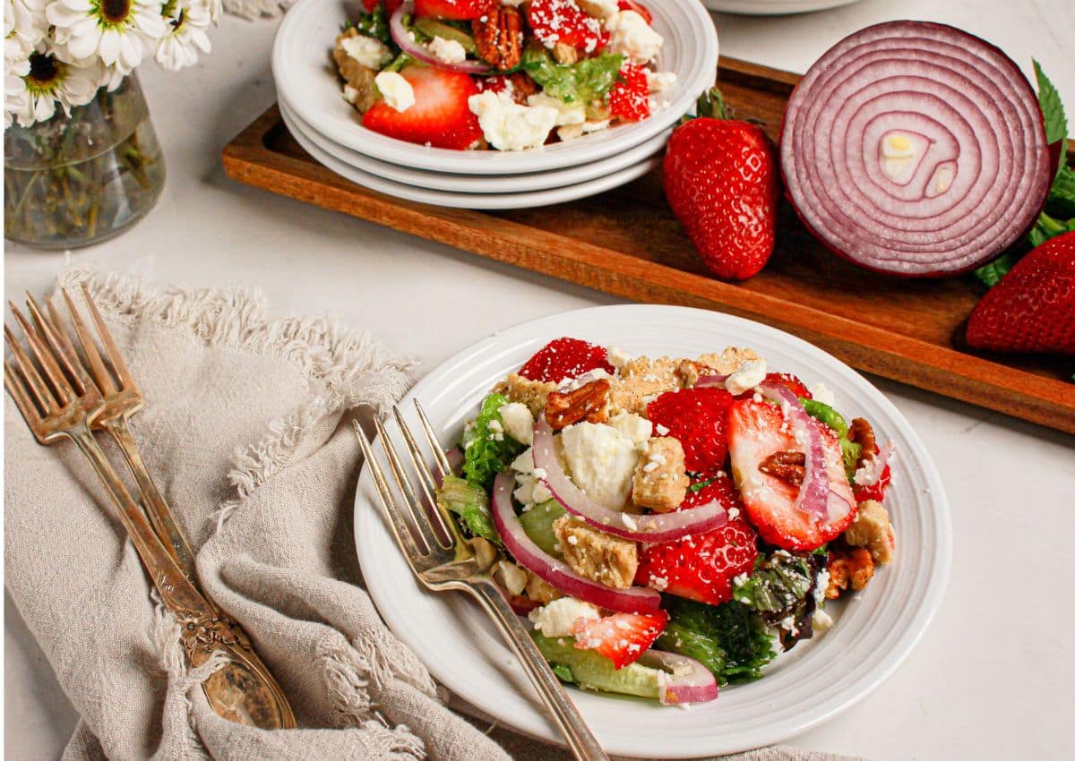 Small plate filled with strawberry fields salad.