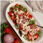Platter full of strawberry fields salad.