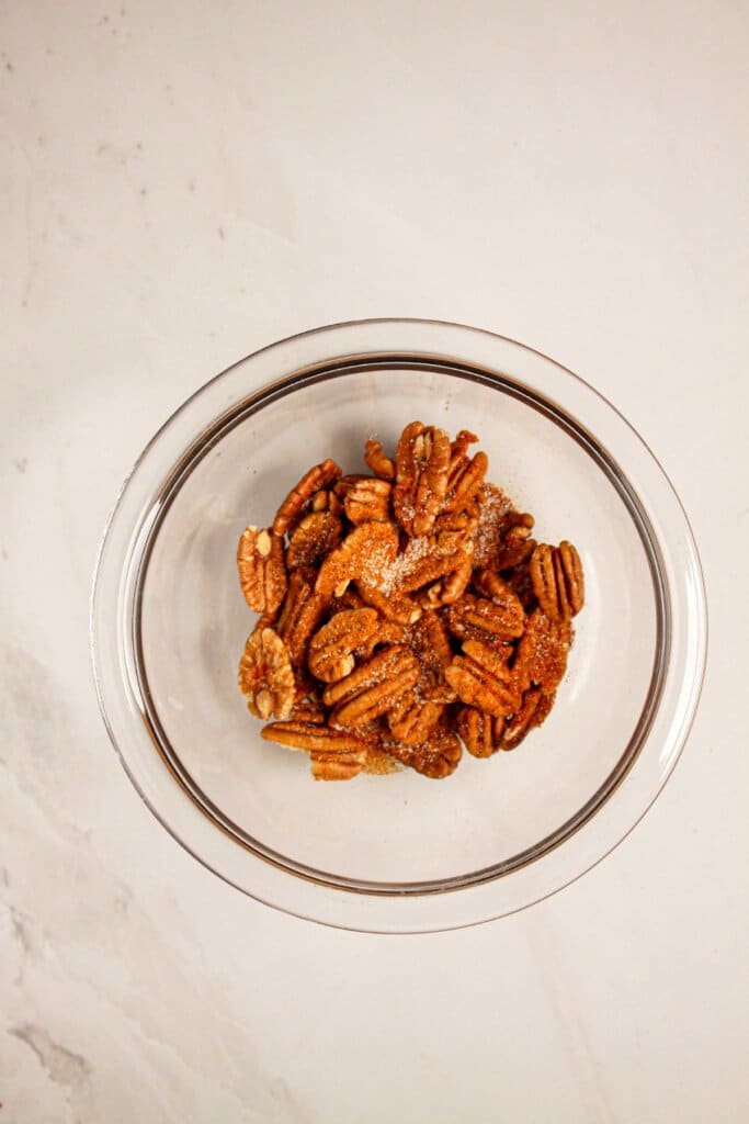 Pecans in a small glass bowl.