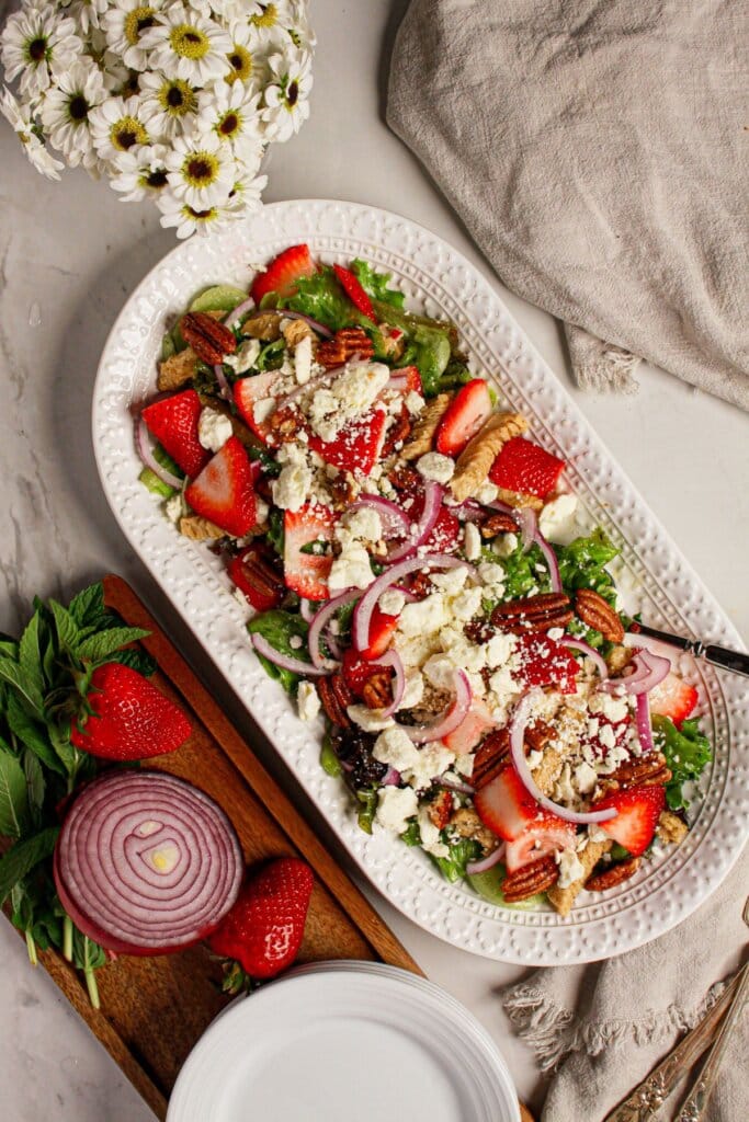 Platter full of strawberry fields salad.