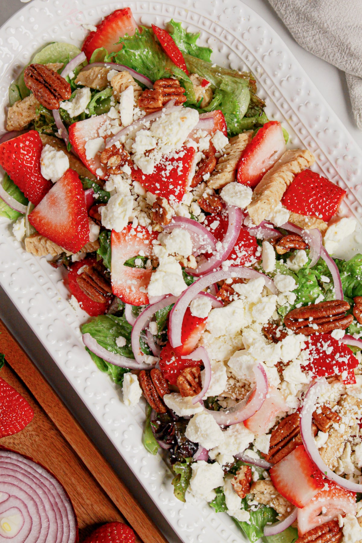 Platter full of strawberry fields salad.