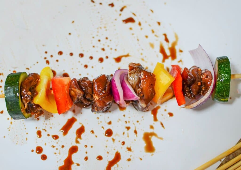 Meat and vegetables on a plate.