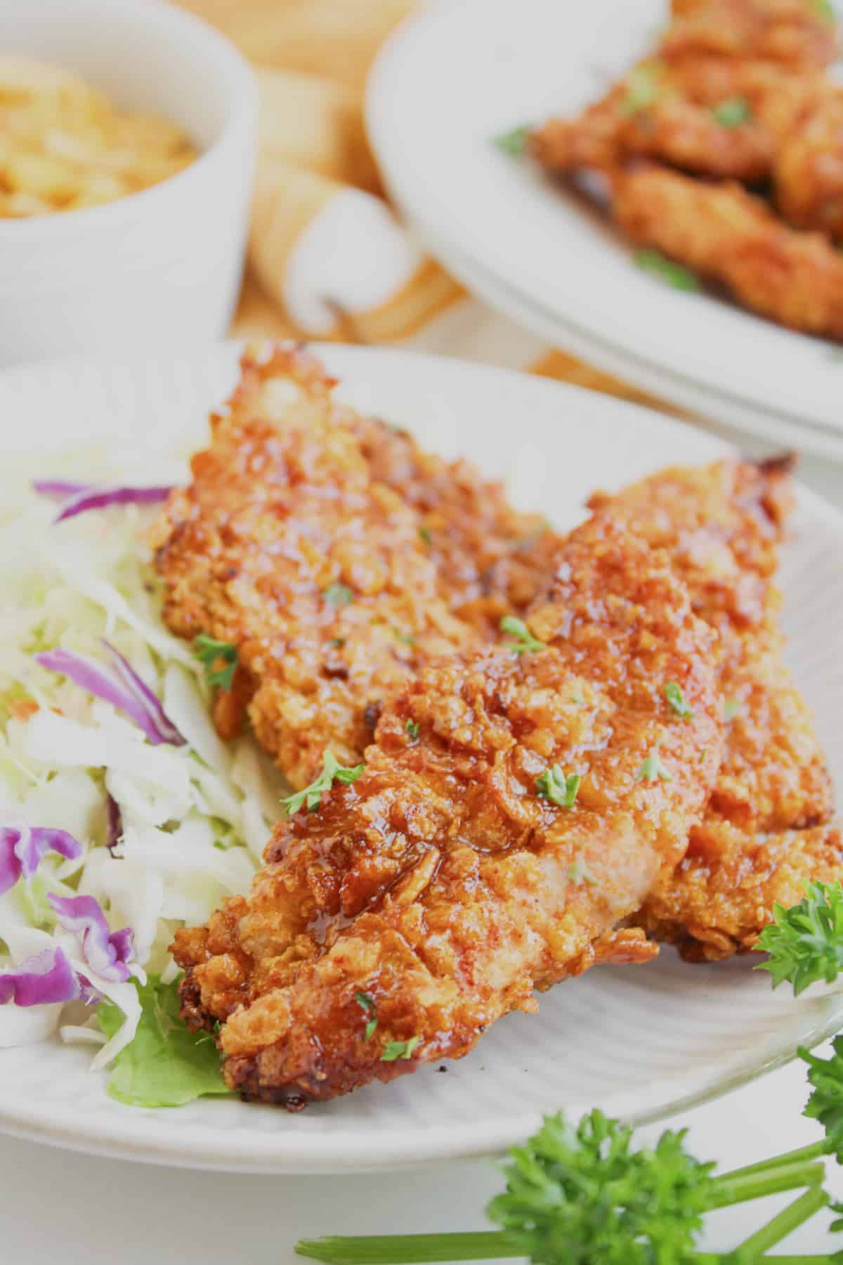 BBQ chicken tenders on a plate.