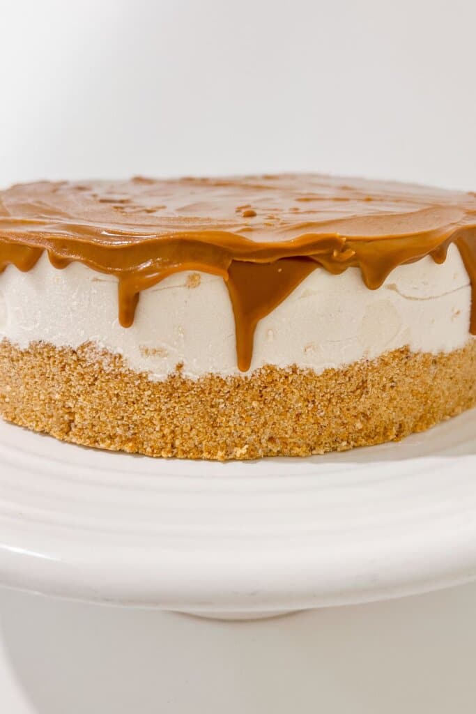 Cookie butter being poured on top of dessert.