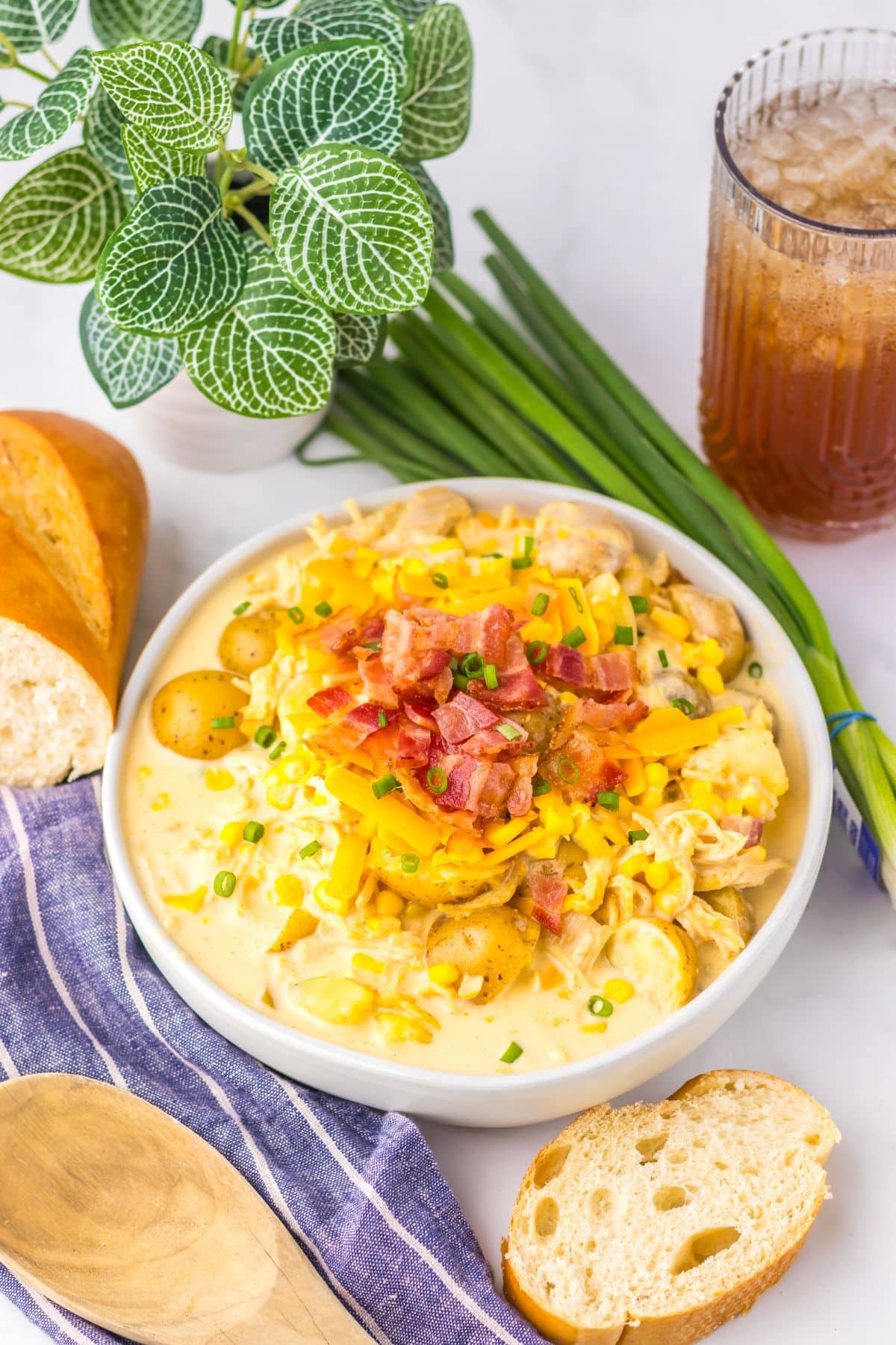 White bowl filled with chicken corn chowder.