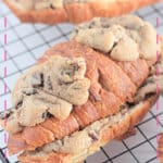 Chocolate chip cookie croissants on a wire cooling rack.