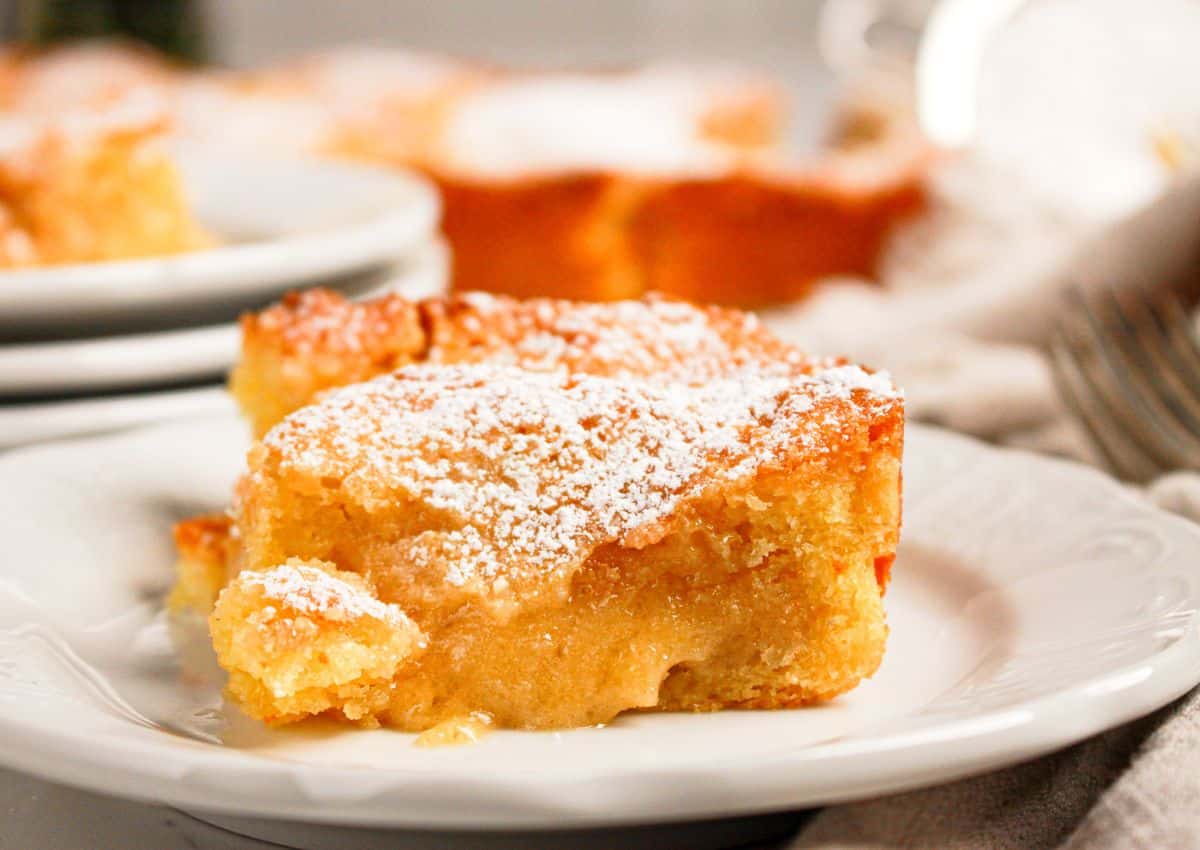 Slice of gooey butter coffee cake on a small plate.