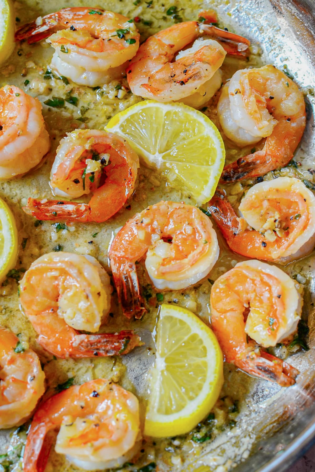 Lemon garlic butter shrimp in a skillet.