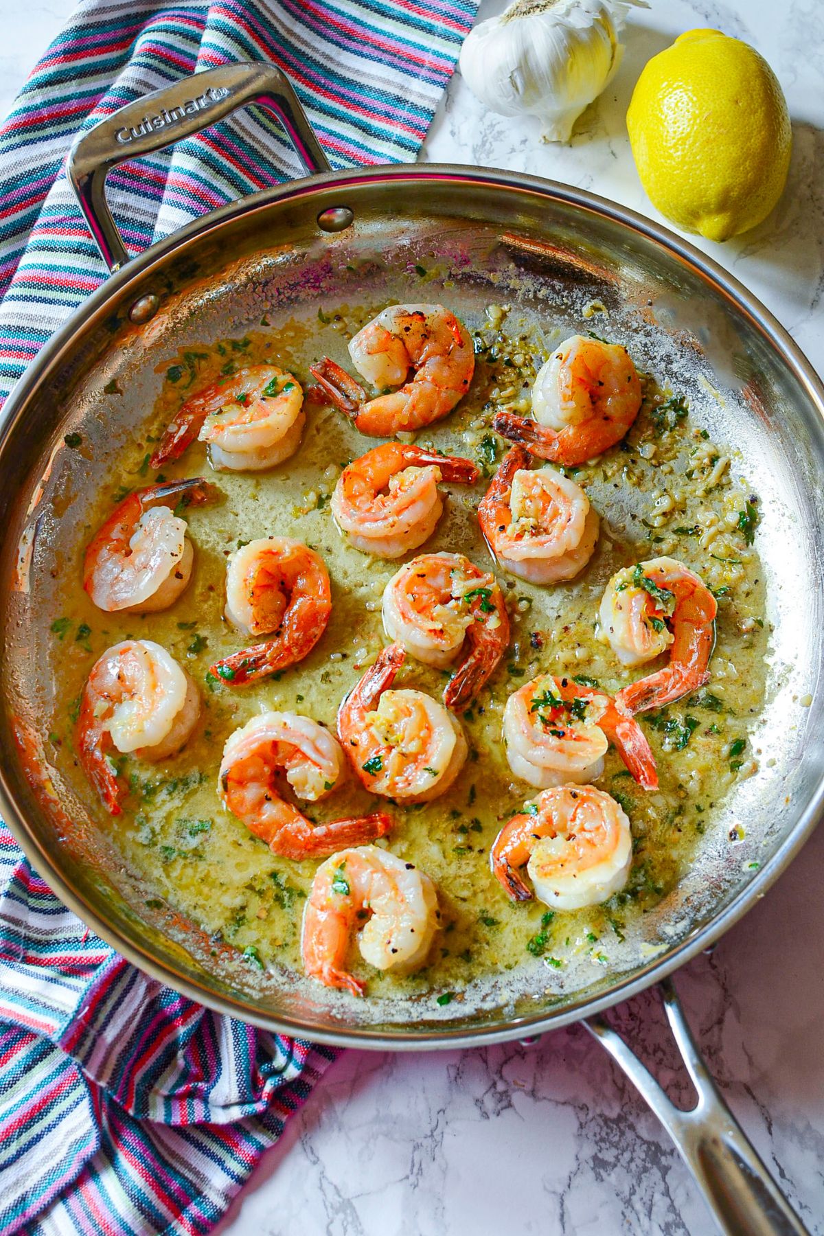 Cooked shrimp in a skillet.