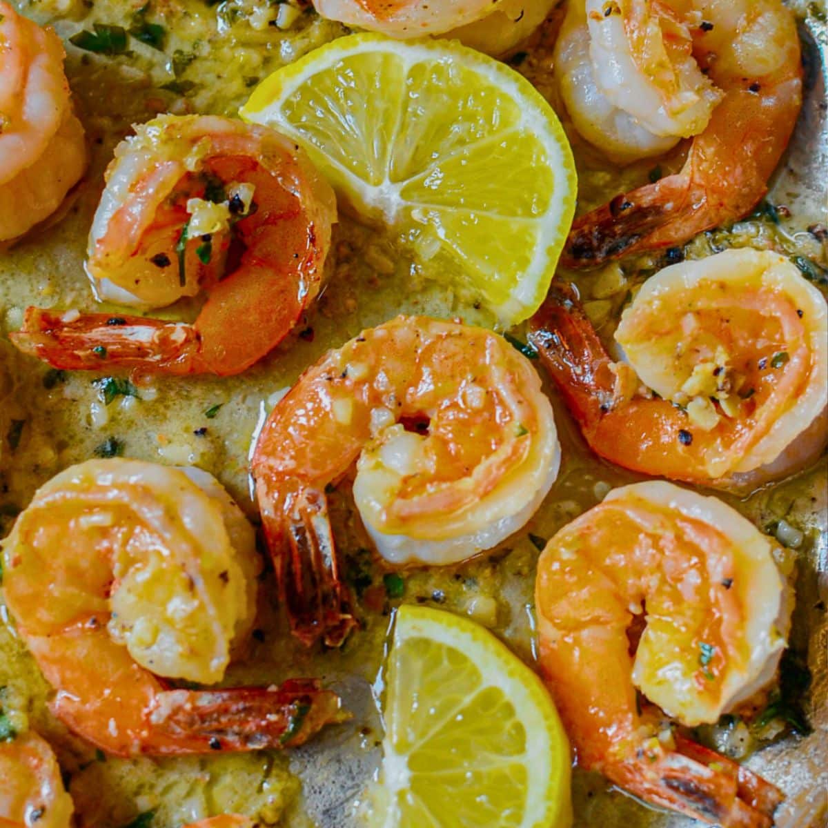 Lemon garlic butter shrimp in a skillet.