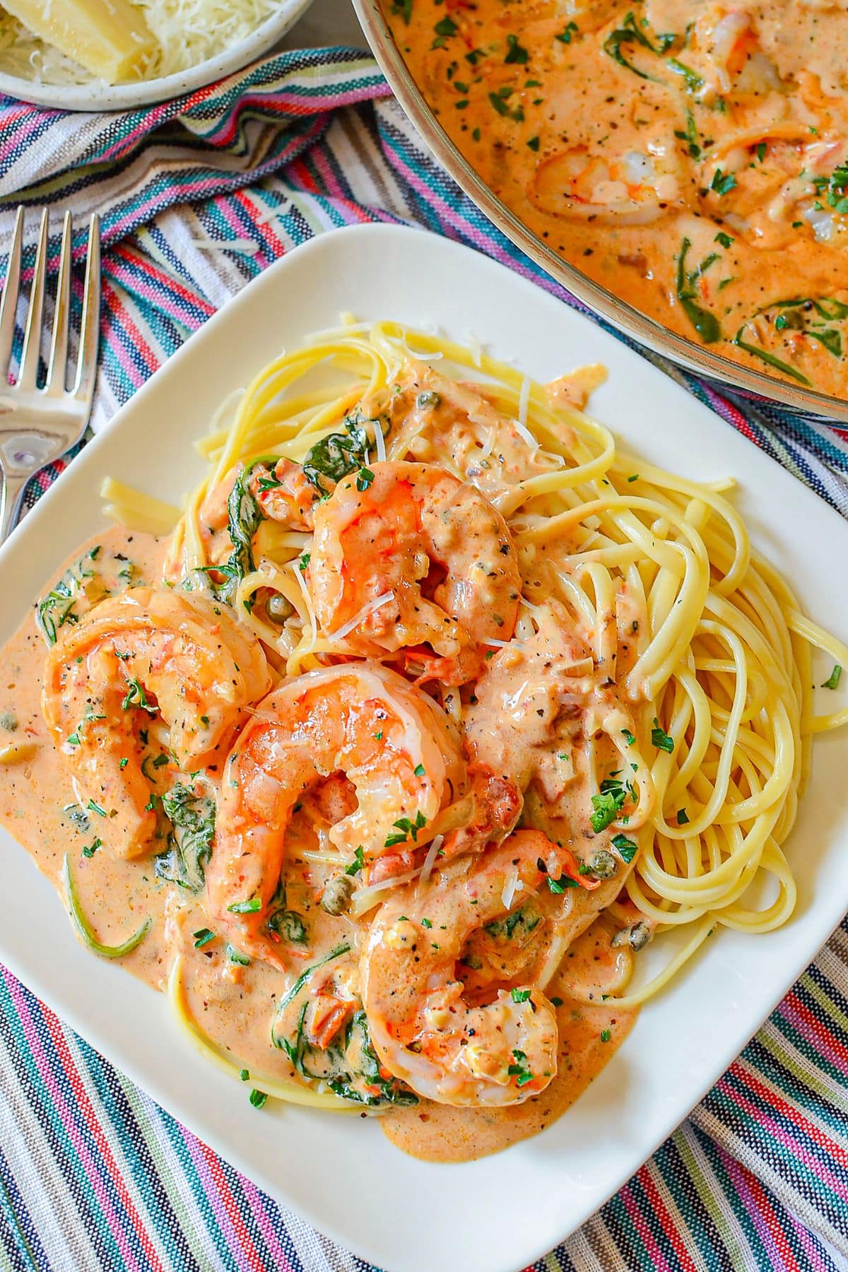 Marry me shrimp on top of a bed of pasta.