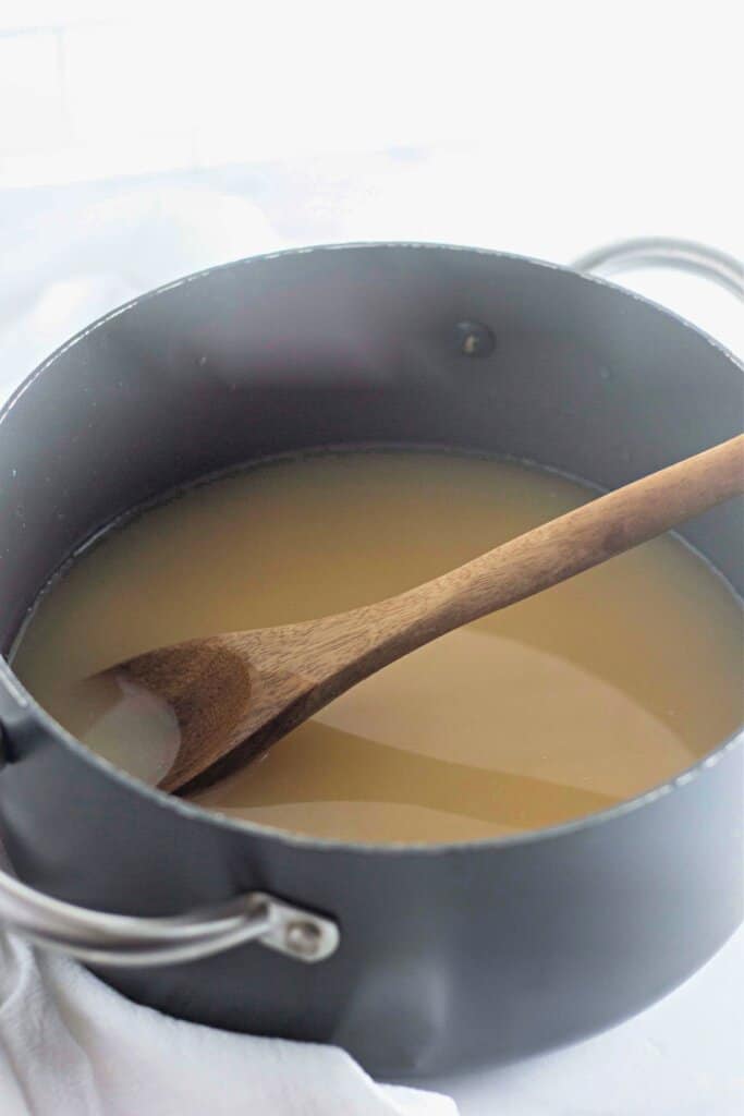 Cream of celery soup and broth in a large pot.