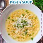 White bowl of parmesan pasta soup with the name in text for pinterest.