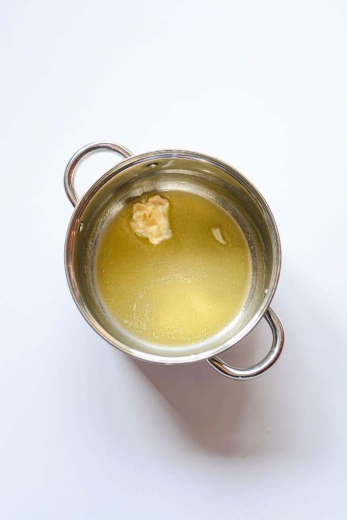 Butter being melted in a pot.