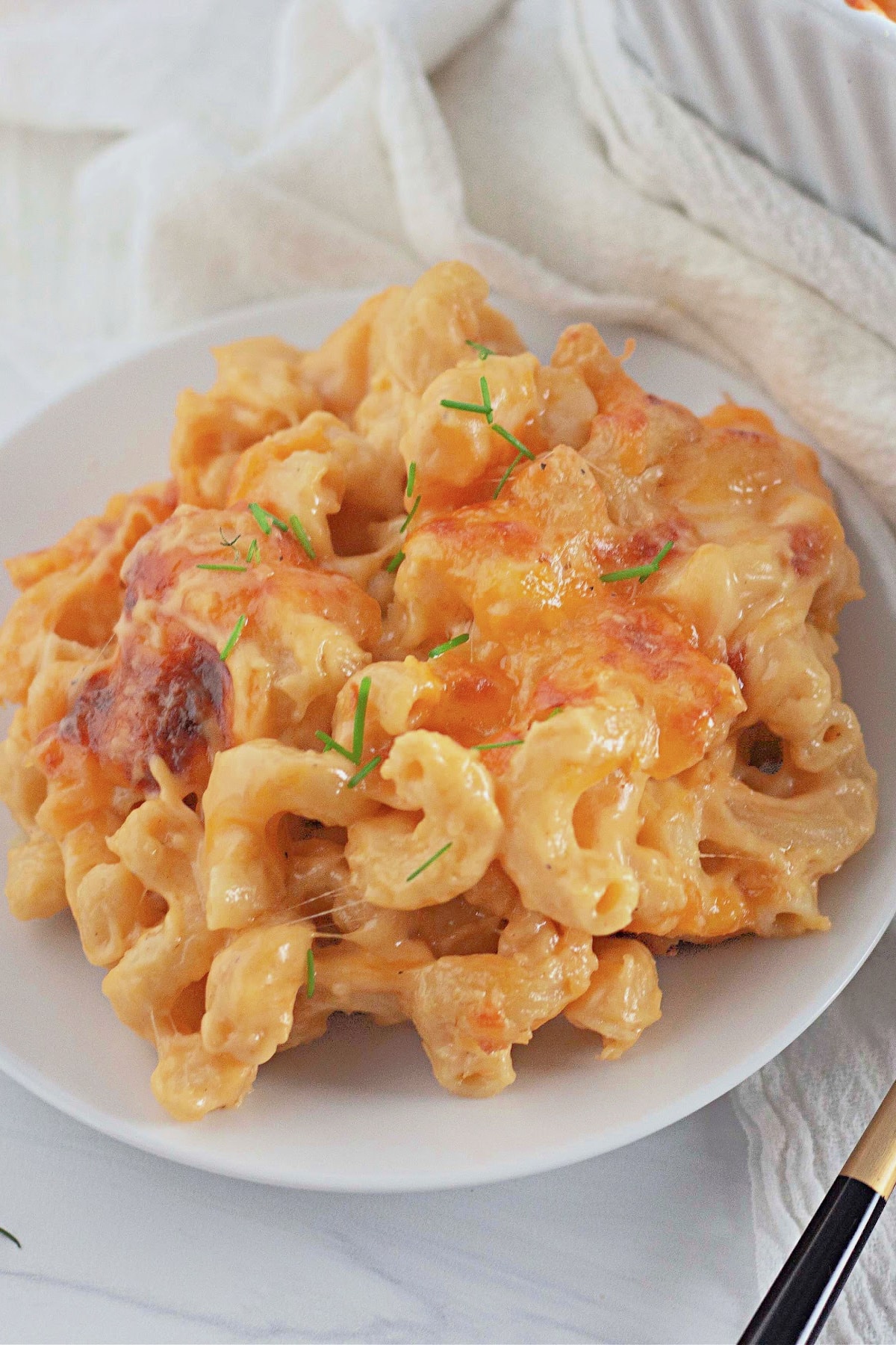 Small plate full of triple mac and cheese.