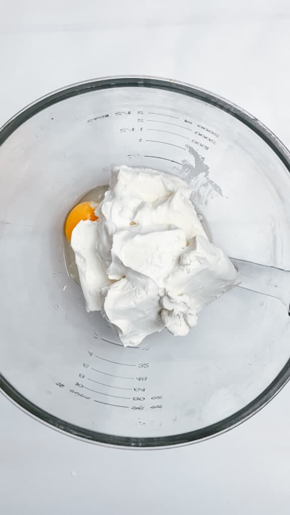 Mixing the ingredients to make the cheesecake batter.