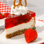 Slice of strawberry pretzel salad cheesecake recipe on a white plate.