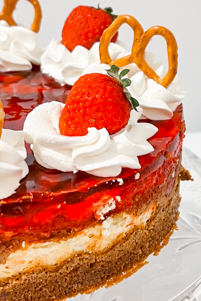 Side view of whole strawberry cheesecake