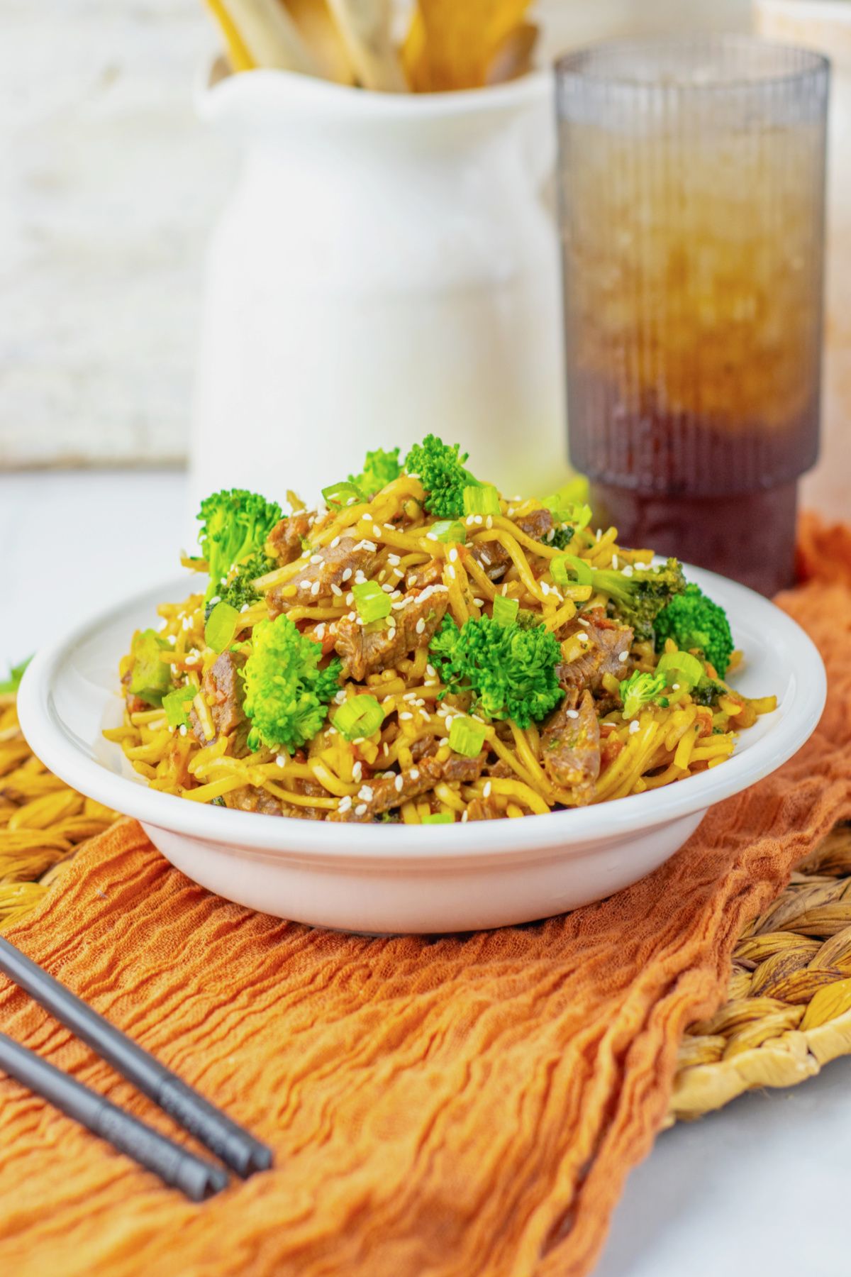 Plate full of beef and broccoli lo mein.