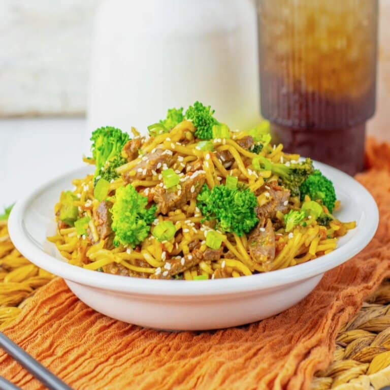 Plate full of beef and broccoli lo mein.