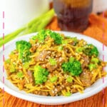 Plate full of beef and broccoli lo mein.