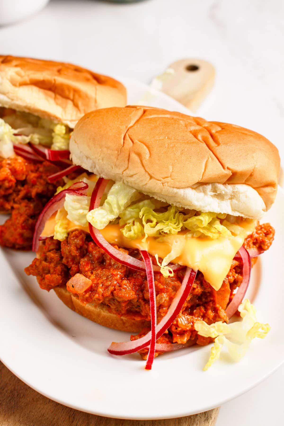 Big mac sloppy joes on a plate.