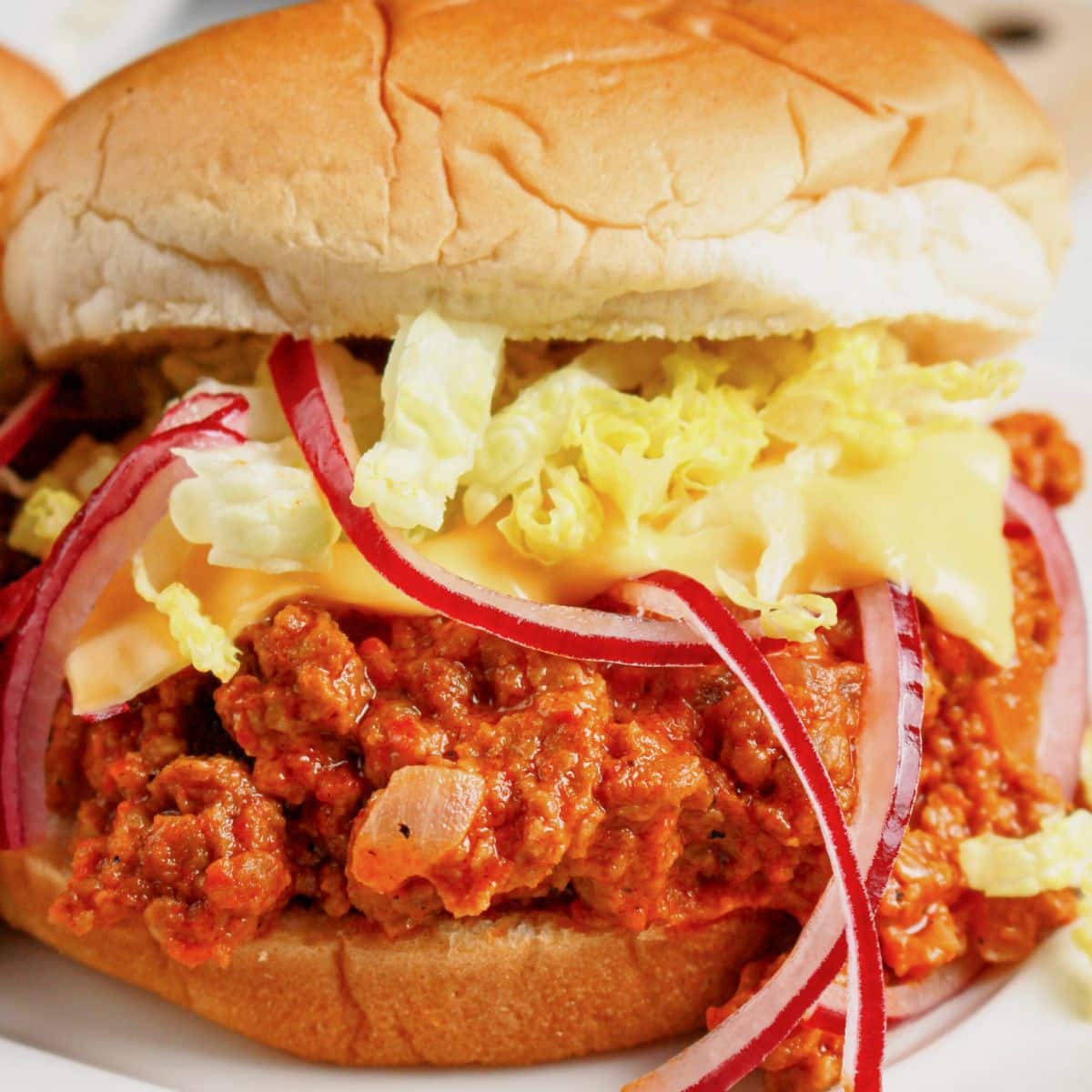 Big mac sloppy joes on a plate.