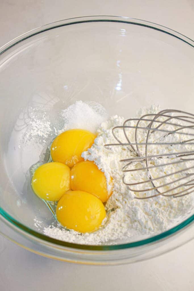 Eggs and cornstarch being whisked together.